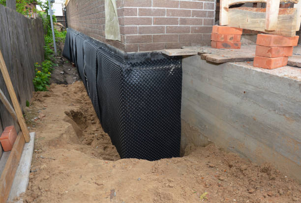 Happy homeowners after waterproofing job in Wales